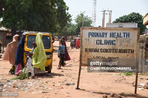 Mothers arrive at primary health clinic, Glgwai Sokoto North in northwest Nigeria, on September 21, 2021. - Gangs of heavily-armed criminals known...