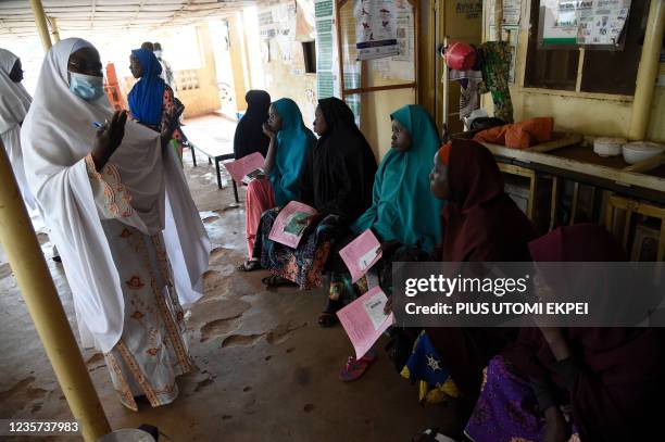 Health official attends to pregnant women at primary health clinic, Glgwai Sokoto North in northwest Nigeria, on September 21, 2021. - Gangs of...