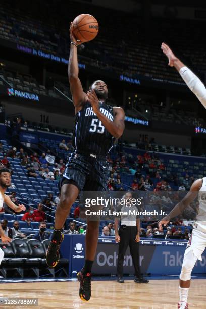 Twaun Moore of the Orlando Magic drives to the basket during a preseason game against the Orlando Magic on October 6, 2021 at the Smoothie King...