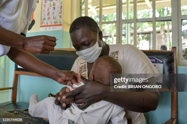 Child gets a malaria vaccination at Yala Sub-County hospital, in Yala, Kenya, on October 7, 2021. - World Health Organization approved using the...