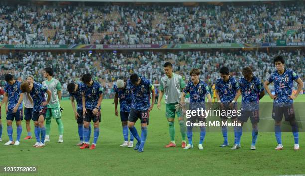 Japanese players bow to the fans after their defeat to Saudi Arabia in the 2022 FIFA World Cup Qualifier match at King Abdullah Sports City on...