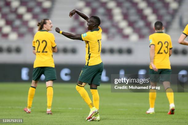 Awer Mabil of Australia celebrates after scoring the first goal during the 2022 FIFA World Cup Qualifier match between Australia and Oman at Khalifa...