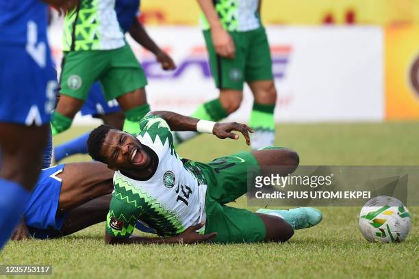 Nigeria's forward Kelechi Iheanacho reacts to an injury during the 2022 Qatar World Cup African qualifiers group 3 football match between Nigeria and...