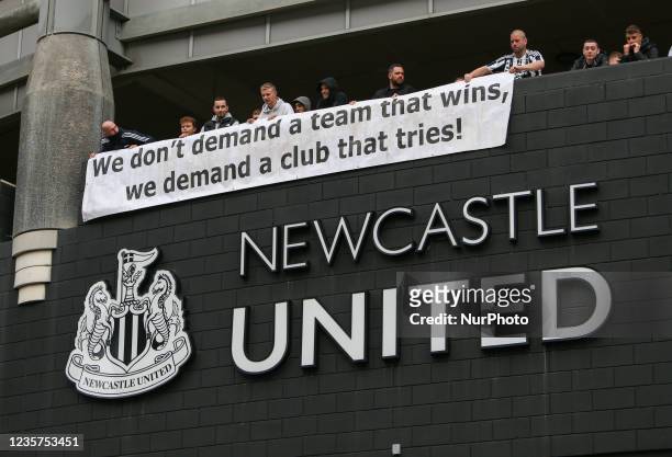 Newcastle United fans hold up a protest banner ahead of the proposed takeover Scenes at St. James's Park, Newcastle as news of a takeover emerges on...