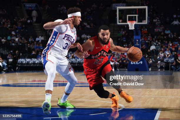 Fred VanVleet of the Toronto Raptors handles the ball against Seth Curry of the Philadelphia 76ers during a preseason game on October 7, 2021 at...
