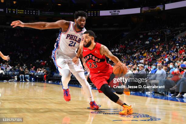 Fred VanVleet of the Toronto Raptors drives to the basket against Joel Embiid of the Philadelphia 76ers during a preseason game on October 7, 2021 at...