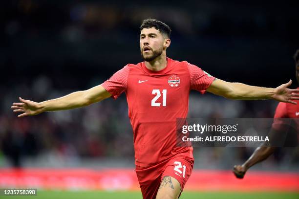 Canada's player Jonathan Osorio celebrates after scoring against Mexico during their Qatar 2022 FIFA World Cup Concacaf qualifier match at the Azteca...