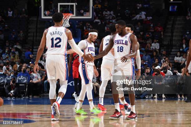 Tobias Harris of the Philadelphia 76ers and Shake Milton of the Philadelphia 76ers high-five during a preseason game on October 7, 2021 at Wells...