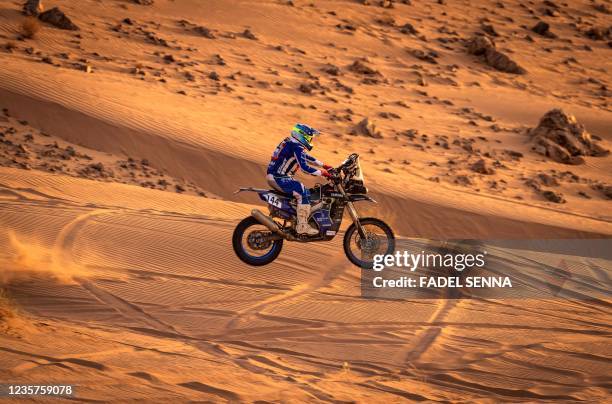 Participant tests his motorcycle ahead of the launch of the Rally of Morocco 2021, in the desert Zagora region, on October 7, 2021. - The rally will...