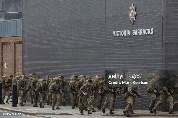 Soldiers return from training with backpacks to Victoria Barracks on 7th October 2021 in Windsor, United Kingdom. Victoria Barracks is home to the...