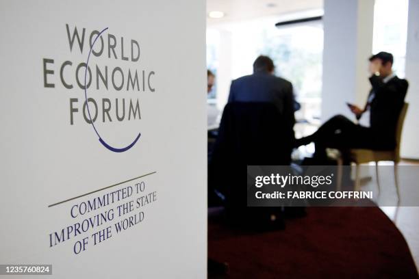 Participant to the World Economic Forum seat at the Davos' congress center during the WEF annual meeting on January 28, 2011 in Davos. British Prime...