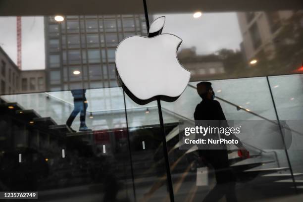 Apple logo is seen on the store in Milan, Italy on October 6, 2021.