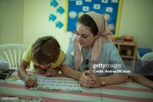 Student practices writing Hebrew letters during sessions at the Jewish Hebrew School on October 8, 2021 in Dubai, United Arab Emirates. The Jewish...