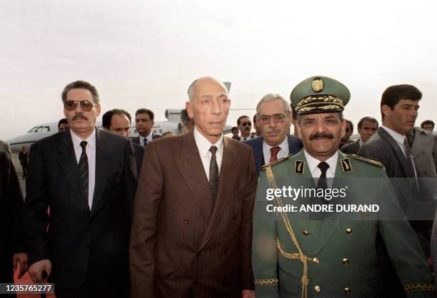 High State Council President Mohamed Boudiaf is surrounded by Army Chief of Staff Abdelmalek Gueneizia , Defence Minister General Khaled Nezzar and...