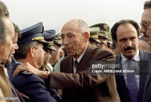 High State Council President Mohamed Boudiaf greets General Abdelmalek Gueneizia , Army Chief of Staff, in Algiers airport 16 January 1992, upon his...