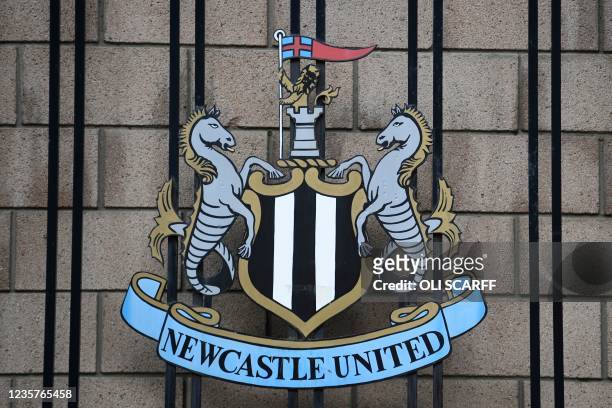 Picture shows the Newcastle United logo outside the club's stadium St James' Park in Newcastle upon Tyne in northeast England on October 8, 2021. - A...