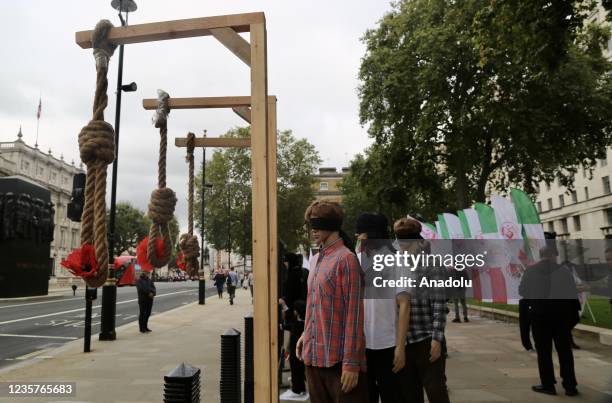 Protesters gather to stage a protest against Iranian President Ebrahim Raisi and executions in Iran ahead of World Day Against the Death Penalty in...