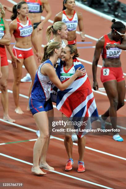 Jessica Ennis representing Great Britain is congratulated by fellow athletes after winning the 800 metres discipline and securing the gold medal in...