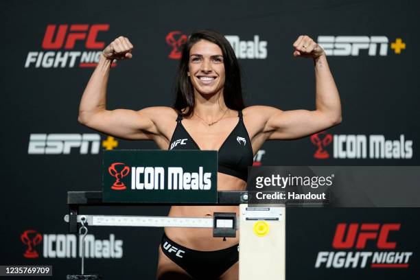 In this UFC handout, Mackenzie Dern poses on the scale during the UFC Fight Night weigh-in at UFC APEX on October 08, 2021 in Las Vegas, Nevada.