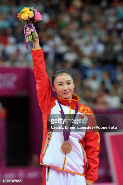 He Wenna representing China celebrates on the podium after receiving the bronze medal following the womens trampoline final on day 8 of the 2012...