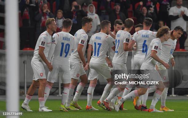 Czech Republic's players celebrate after scoring during the FIFA World Cup Qatar 2022 qualification Group E football match between the Czech Republic...