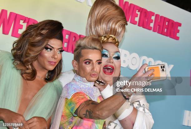 YouTube personality Frankie Grande takes a selfie with drag queen/producers Shangela and Eureka as they arrive for the Los Angeles Premiere of Season...