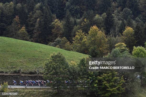 The pack rides during the 115th edition of the Giro di Lombardia , a 239 km cycling race from Como to Bergamo on October 9, 2021.