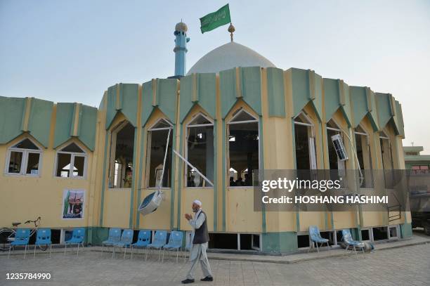 Man walks outside the Sayed Abad Shiite mosque a day after a suicide bomb attack on worshippers in which at least 55 people died, in Kunduz on...