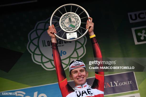 Team UAE Emirates' Tadej Pogacar of Slovenia celebrates on podium at the end of the 115th edition of the giro di Lombardia , a 239 km cycling race...