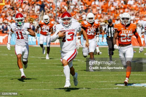 Oklahoma Sooners quarterback Caleb Williams runs for a touchdown during the Red River Showdown between the Texas Longhorns and the Oklahoma Sooners...