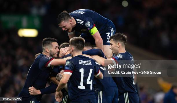 Scotlands Scott McTominay celebrates witj teammates after scoring to make it 3-2 during a FIFA World Cup Qualifier between Scotland and Israel at...