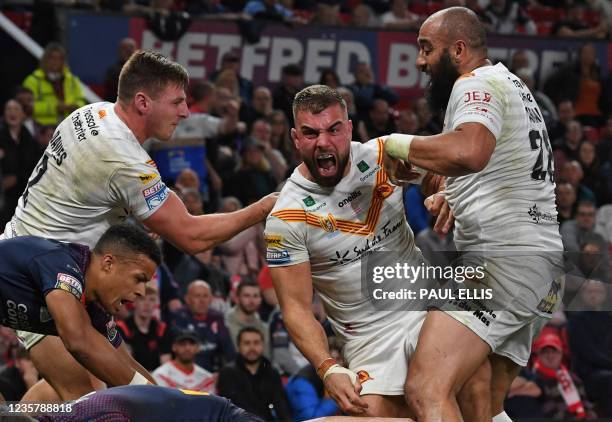 Catalans Dragons' Mike McMeeken celebrates after scoring his team's first try during the Super League Grand Final rugby league match between Catalans...