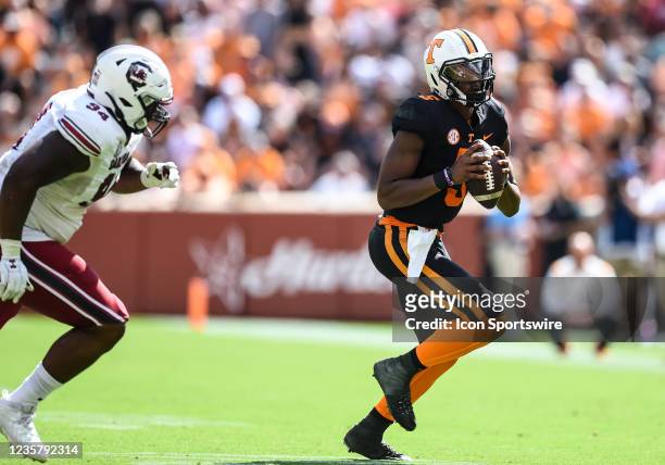 Tennessee Volunteers quarterback Hendon Hooker being chased by South Carolina Gamecocks defensive lineman M.J. Webb during the game on October 9 at...