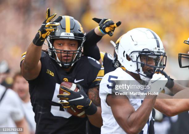 Linebacker Jestin Jacobs of the Iowa Hawkeyes celebrates during the first half after intercepting a pass intended for wide receiver Jahan Dotson of...