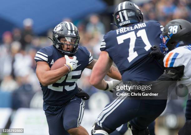 Tyler Allgeier of the BYU Cougars rushes the ball against the Boise State Broncos during their game October 9, 2021 at LaVell Edwards Stadium in...
