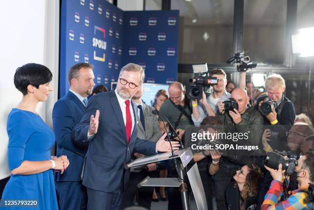 Leader of the coalition SPOLU and chairman of ODS party Petr Fiala speaks to the media and the polling officials of SPOLU in Prague after polling...