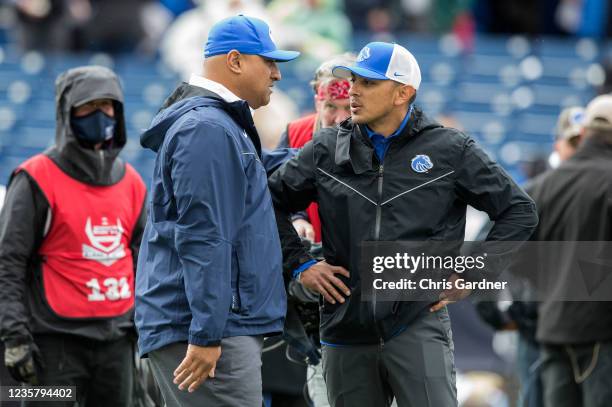 Andy Avalos head coach of the Boise State Broncos talks with Kalani Sitake head coach of the BYU Cougars during their game October 9, 2021 at LaVell...