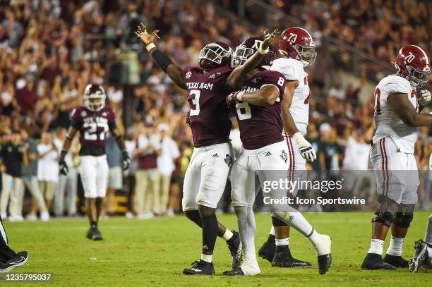Texas A&M Aggies defensive lineman Tyree Johnson celebrates his sack with Texas A&M Aggies defensive lineman DeMarvin Leal during first half action...