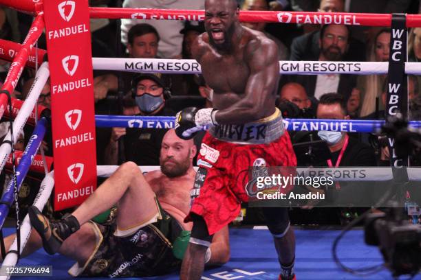 Tyson Fury and Deontay Wilder exchange punches during their fight for the WBC heavyweight championship on October 9, 2021 in Las Vegas, Nevada.