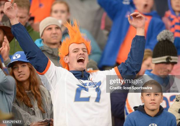 Boise State Bronco fan celebrates at the end of a game between the Boise State Broncos and BYU Cougars on October 9 at LaVell Edwards Stadium in...