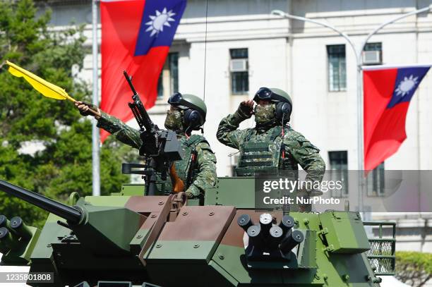 Taiwanese soldiers on a armoured vehicle during the National Day Celebration, following Chinese President Xi Jinpings vow to unify Taiwan by peaceful...