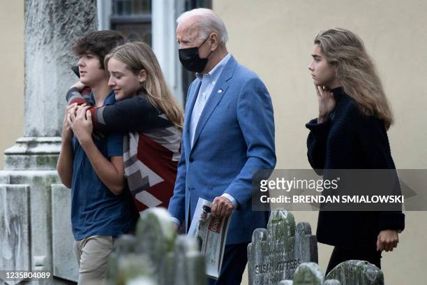 Robert Hunter Biden II, Finnegan Biden, and Natalie Biden walk with their grandfather US President Joe Biden after Sunday mass at Saint Joseph on the...