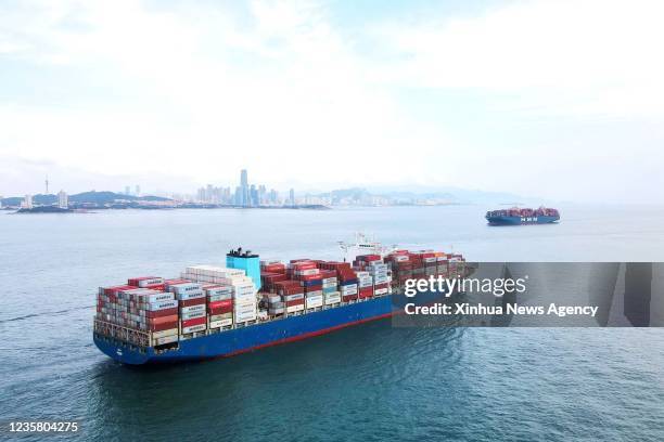 Container ship is seen on the sea of Jiaozhou Gulf, north China's Shandong Province, Aug. 7, 2021.