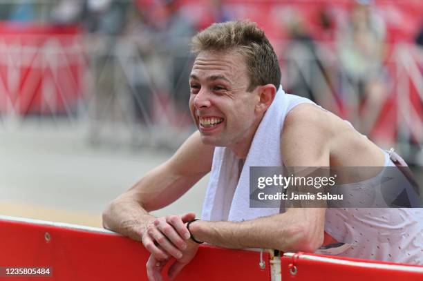 Galen Rupp of the United States recovers in the finish area after finishing second with a time of 2:06:35 during the 2021 Chicago Marathon on October...