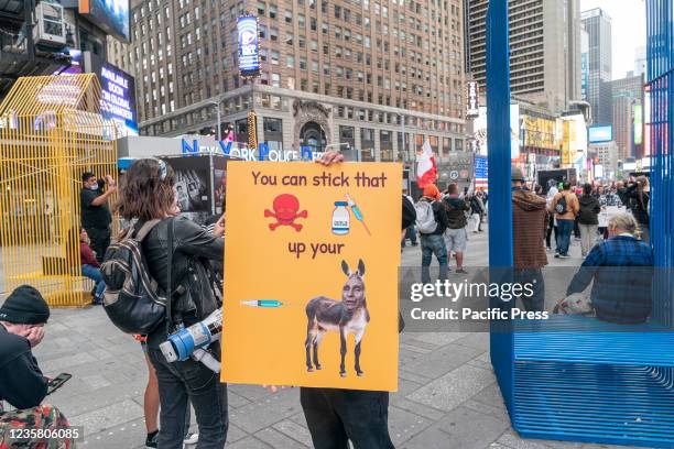 Thin crowd of anti-vaxxers protested on Times Square against vaccination mandates for many professions. Speakers at the protest promoted conspiracy...