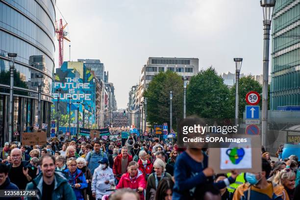 Protesters march around the European Union building during the demonstration. After a year and a half, Youth for the Climate the school-strike...