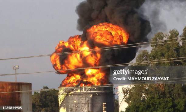 Smoke billows from a huge fire in one of the tanks at the Zahrani oil facility in southern Lebanon on October 11 sparking alarm as the country...