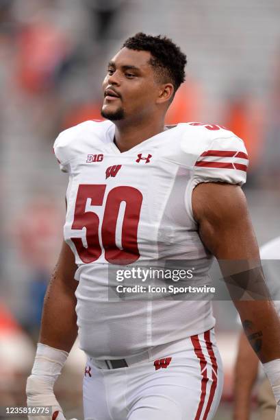 Wisconsin Badgers offensive lineman Logan Brown walks off the field at the conclusion of the Big Ten conference college football game between the...