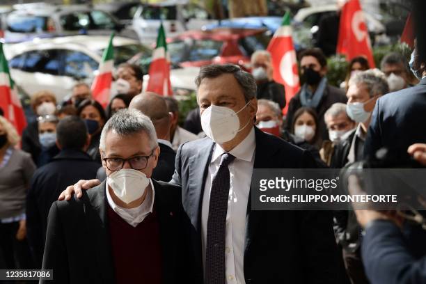 Italian Prime Minister, Mario Draghi , is welcomed by the General Secretary of the national trade union Italian General Confederation of Labour...