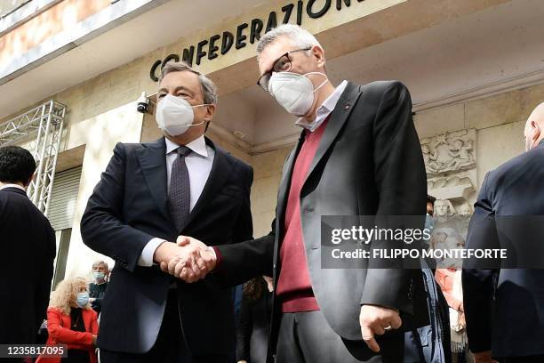 Italian Prime Minister, Mario Draghi , is welcomed by the General Secretary of the national trade union Italian General Confederation of Labour...